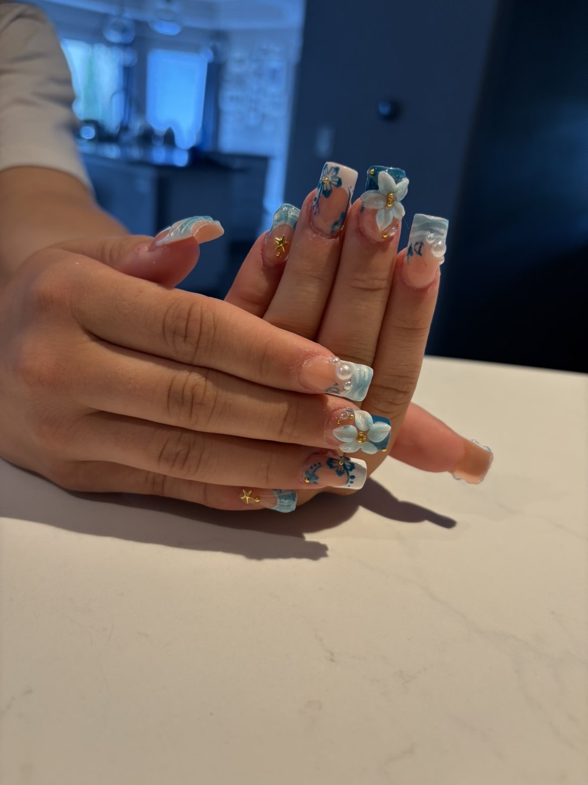 Ocean blue French tips with 3D floral accents